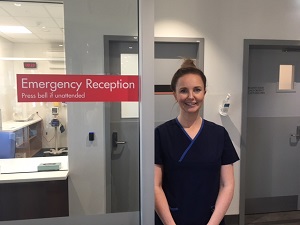 Health professional at Emergency Department reception.