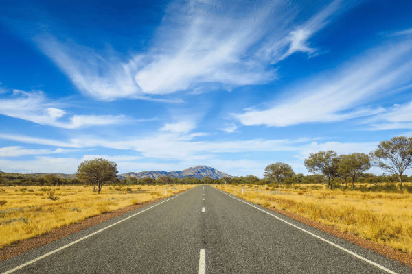 Country road in Western Australia with bright blue sky