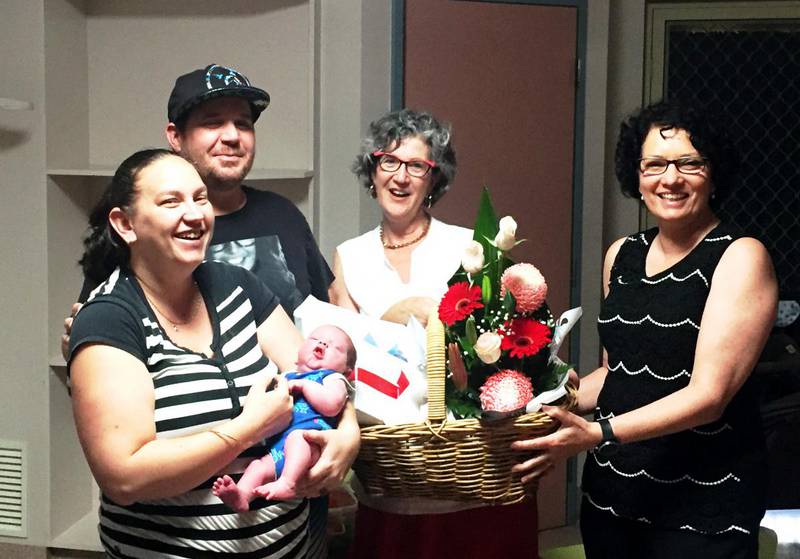 Happy parents Liz and Jeremy Osborne receive flowers from their midwives Marie Hill (left) and Judi Turner. Their son Thomas John was the first baby born at Northam Hospital in two years thanks to its new Midwifery Group Practice.