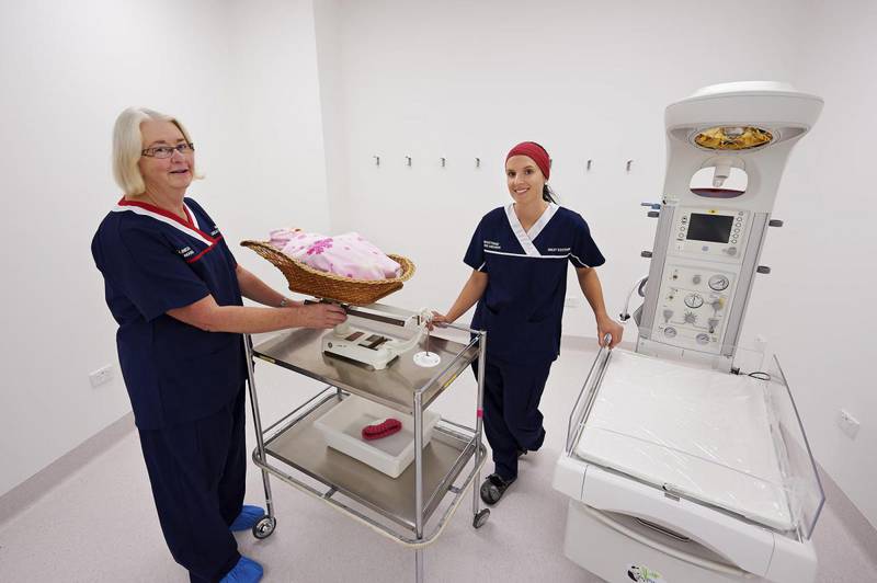 Female midwives and dummy baby