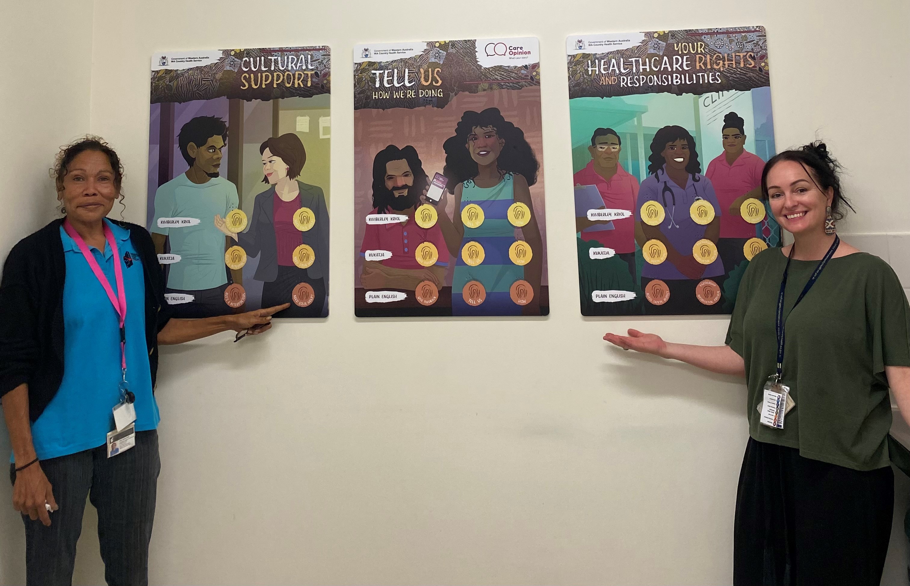 Aboriginal Interpreting Services WA's Healema Ward and WA Country Health Service Kimberley Quality Coordinator Jo Bull stand beside the new talking posters