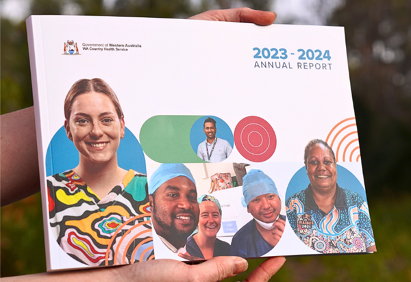 Close-up picture of somebody holding the 2023-24 Annual Report