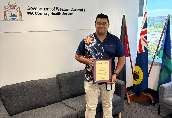 WA Country Health Service Program Officer Raghav Sridhara holding the Institute of Hospitality in Healthcare 2025 national Leadership Award
