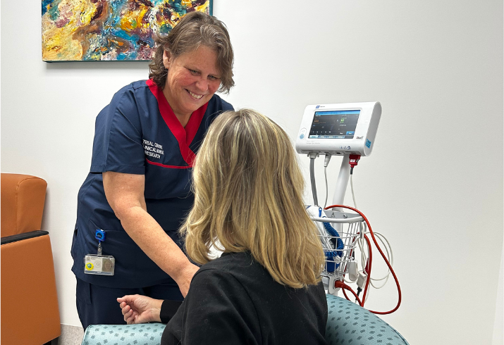 Patient sitting in a chair receiving care in Albany