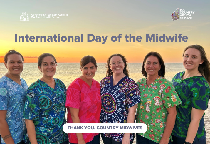 A group of nurses in brightly coloured scrubs stand by the ocean at sunset