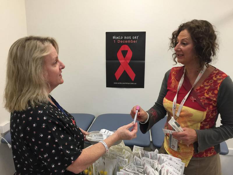The WA Country Health Service’s Dr Marisa Gilles and Michelle Young prepare testing kits for World Aids Day on 1 December.