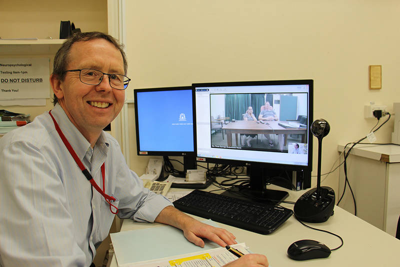 Dr Nick Lawn, Neurologist at the Royal Perth Hospital and Sir Charles Gairdner Hospital, with Wayne Kipps (pictured on-screen)