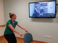 Paul Hinds receives treatment via telehealth from physiotherapist Naomi Ramsay.