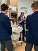 Albany midwife, Jo Orr, demonstrates a birth to local high school students.