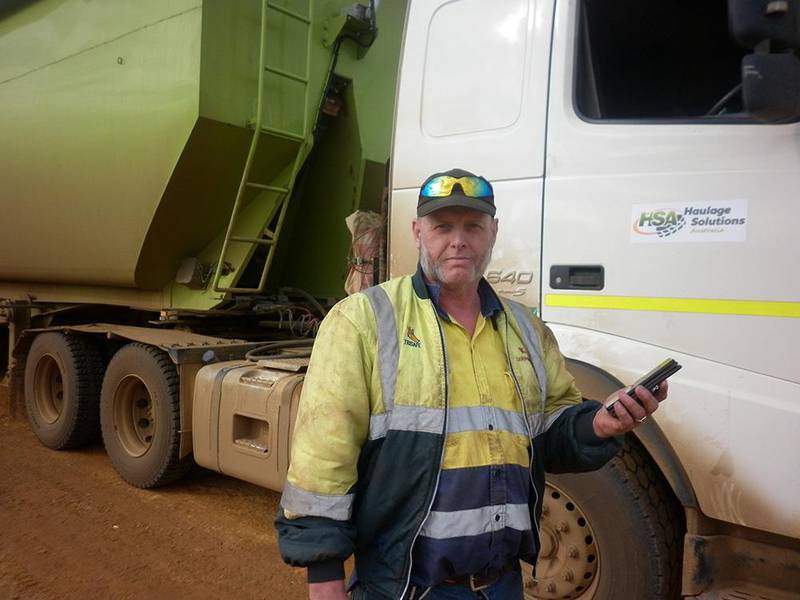 Esperance truck-driver Ian Barlow with his truck and the mobile phone he uses to carry out telehealth appointments with his cancer specialists in Perth.