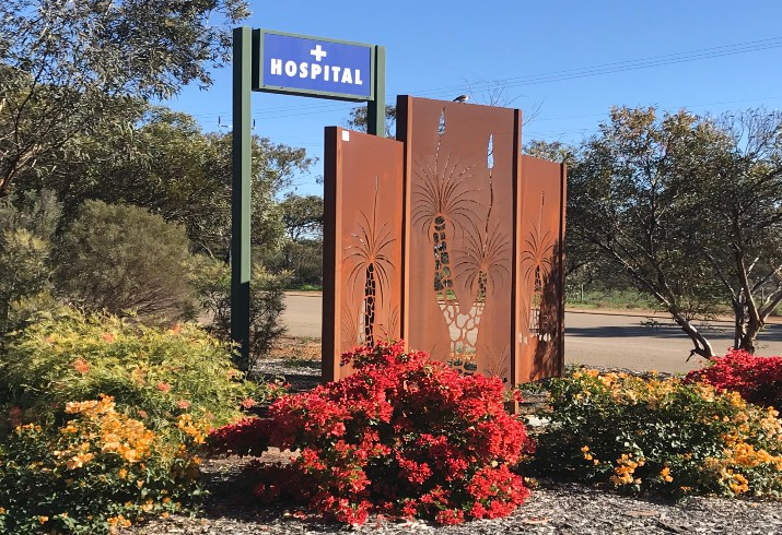 Metal sculpture with grass trees at the entrance to Dalwallinu hospital